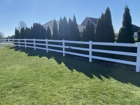 Wood rail fencing with wire mesh
