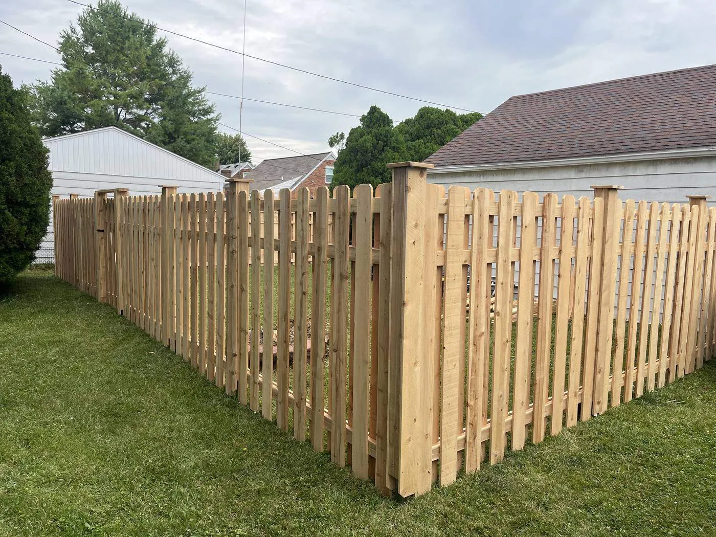 Cedar picket fence at a corner