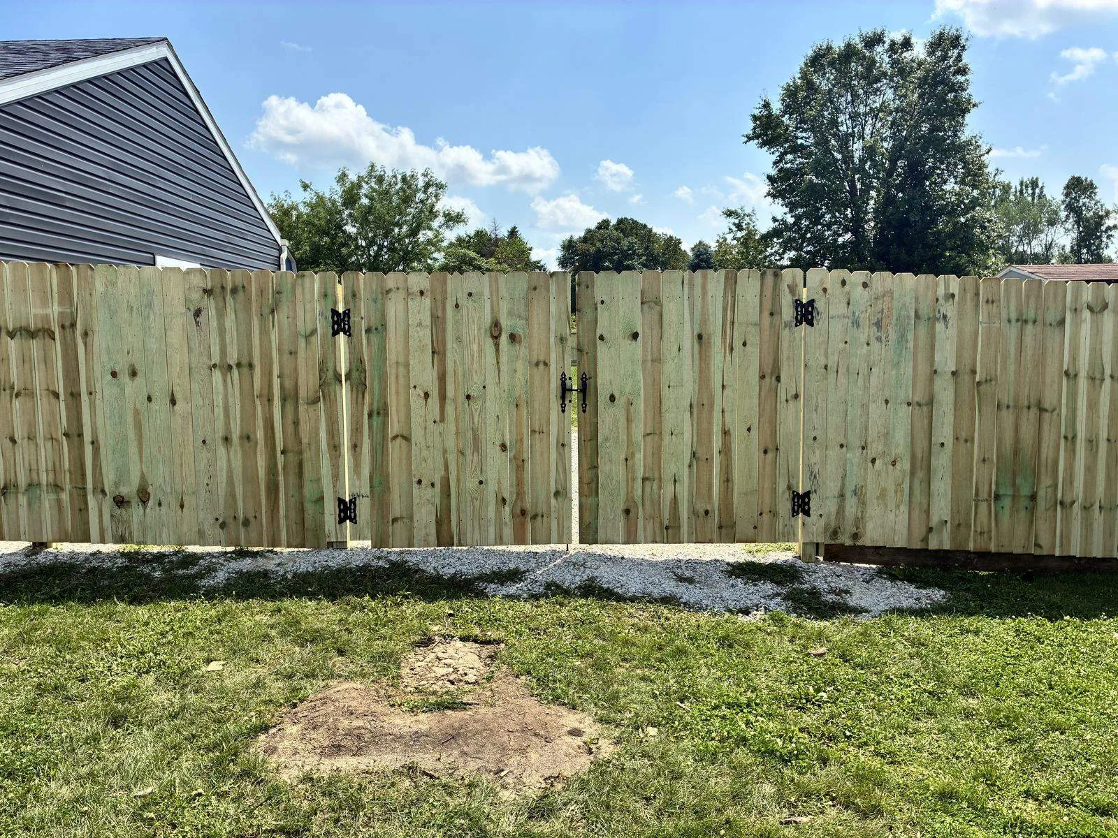 Privacy fence with double gate and finished hardware