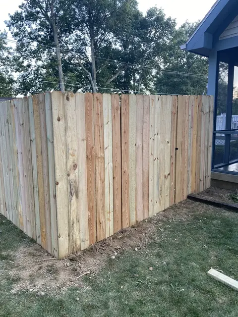 Board-on-board wood privacy fencing