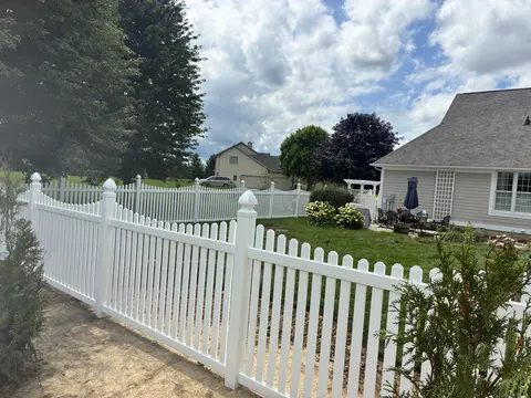 White vinyl picket fence
