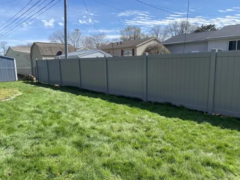 Gray privacy vinyl fencing
