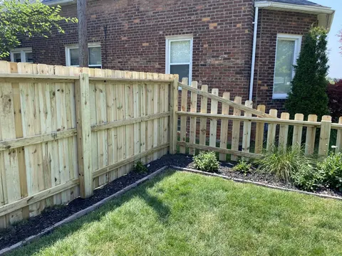 Wood fencing with a change in height