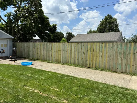 Board-on-board wood privacy fencing