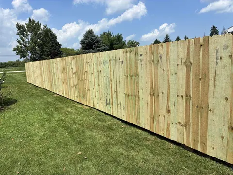 Long wood privacy fence.