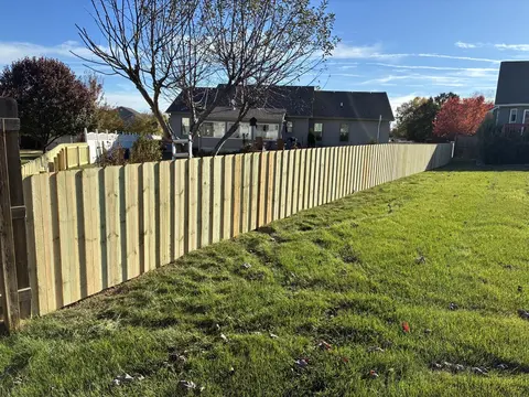 Board-on-board wood privacy fencing