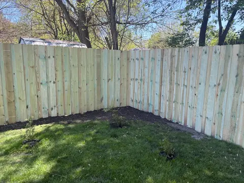 Board-on-board wood privacy fencing