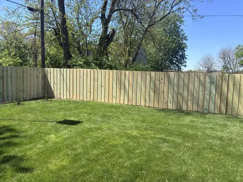 Board-on-board wood privacy fencing