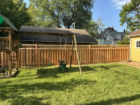 Wood privacy fence with lattice above the boards