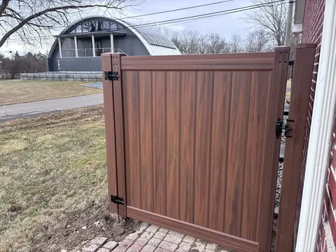 Woodgrain privacy vinyl fencing