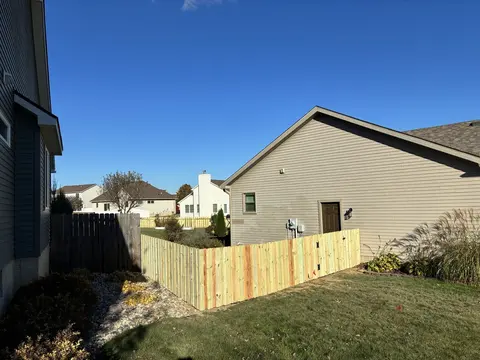 Board-on-board wood privacy fencing