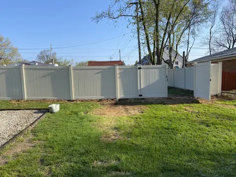 Gray privacy vinyl fencing