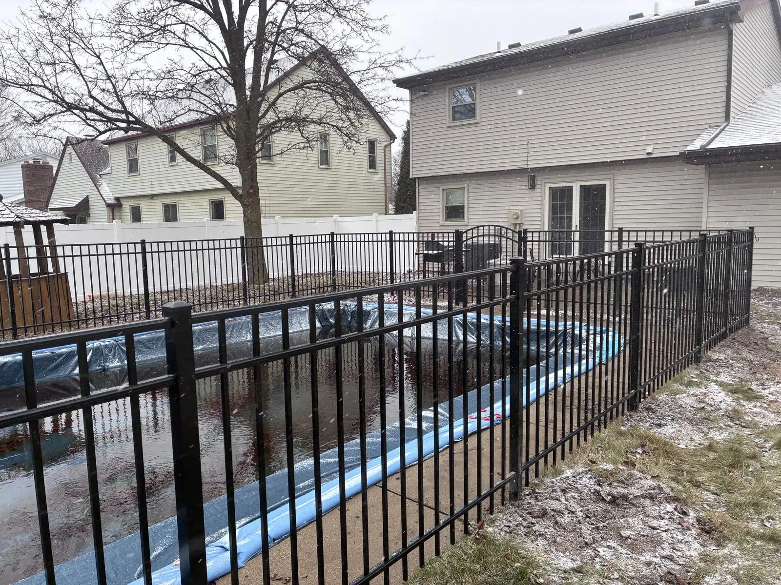 Fence installed on a Toledo property in winter conditions