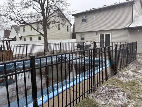 Ornamental metal fence with an arched gate