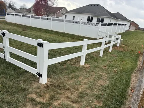 Wood rail fencing with wire mesh