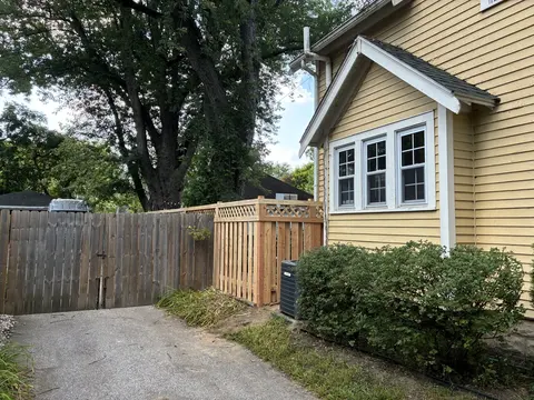 Wood privacy fence with lattice above the boards