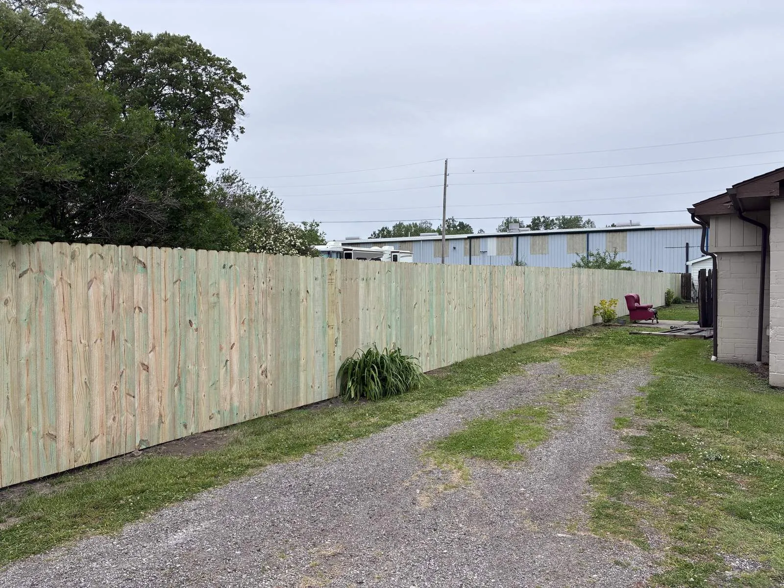 Long pressure-treated privacy fence run