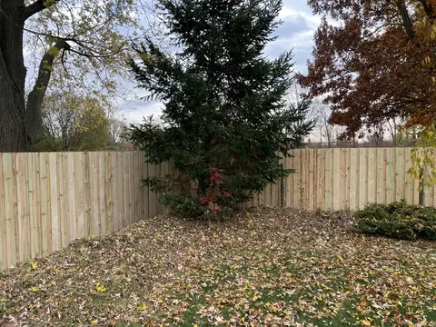 Board-on-board wood privacy fencing