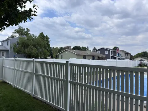 Vinyl Picket Fence Beside a Pool