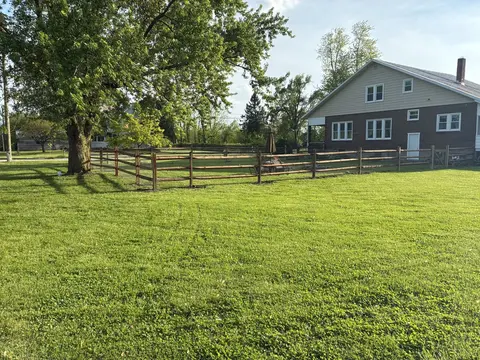Wood rail fencing with wire mesh