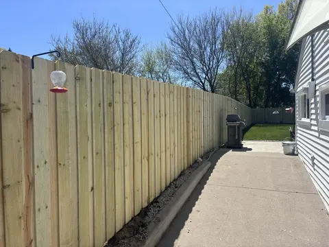 Board-on-board wood privacy fencing