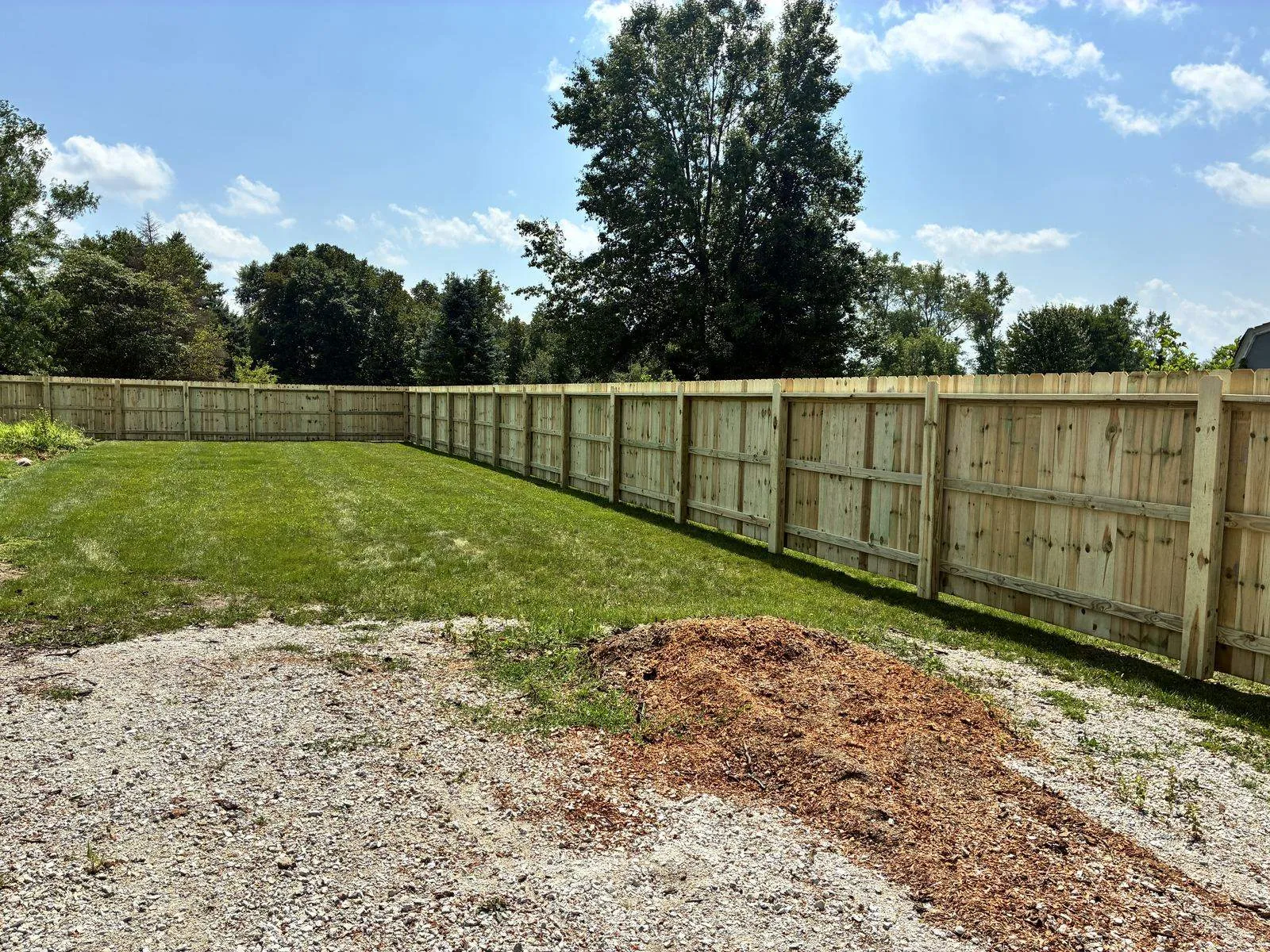 Three-rail construction on the back side of a Ghareeb privacy fence